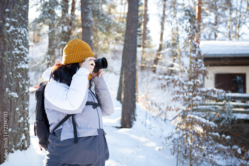 Woman Photographer Taking A Photograph In Nature