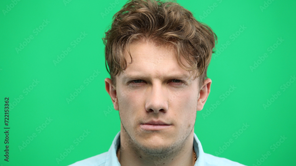 Obraz premium Man's face, close-up, on a green background