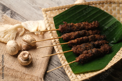 Sate Jamur, is a satay made from oyster mushrooms and edible mushrooms grilled with peanut sauce. This food is suitable for dieters and vegetarians or vegans. Indonesian food. Jamur merang tiram. 