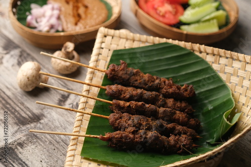 Vászonkép Sate Jamur, is a satay made from oyster mushrooms and edible mushrooms grilled with peanut sauce