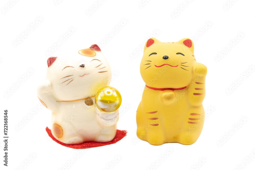 Two Maneki-neko money cats or prosperity cats isolated on white background is a symbol of good luck, prosperity and good fortune. Two Maneki-neko money cats or prosperity cats isolated on white background is a symbol of good luck, prosperity and good fortune.