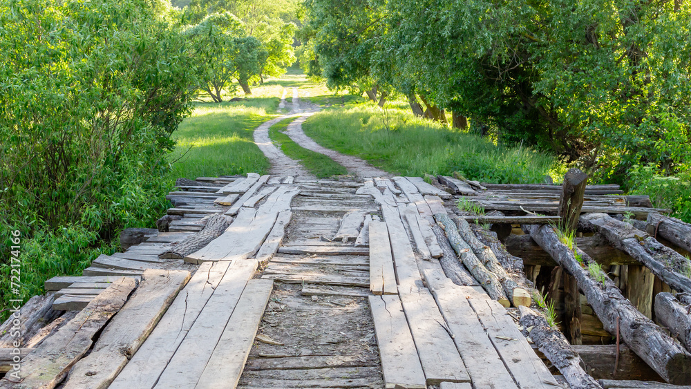 old wooden bridge over the river in the countryside old wooden bridge over the river in the countryside