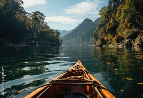 Amidst a serene lake surrounded by majestic mountains, a lone kayaker navigates through the tranquil waters, using only their paddle as a means of transportation