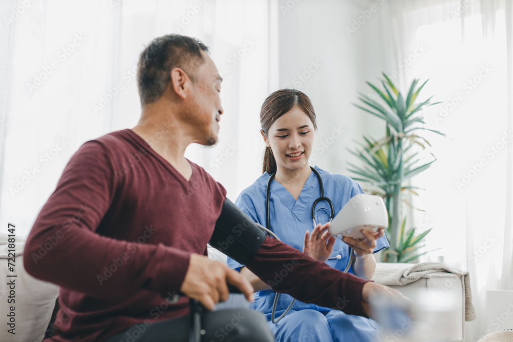 Caregiver nurse measuring blood pressure by using digital sphygmomanometer Senior patient at home. Caregiver nurse using medical device to measure blood pressure Senior patient Caregiver nurse measuring blood pressure by using digital sphygmomanometer Senior patient at home. Caregiver nurse using medical device to measure blood pressure Senior patient