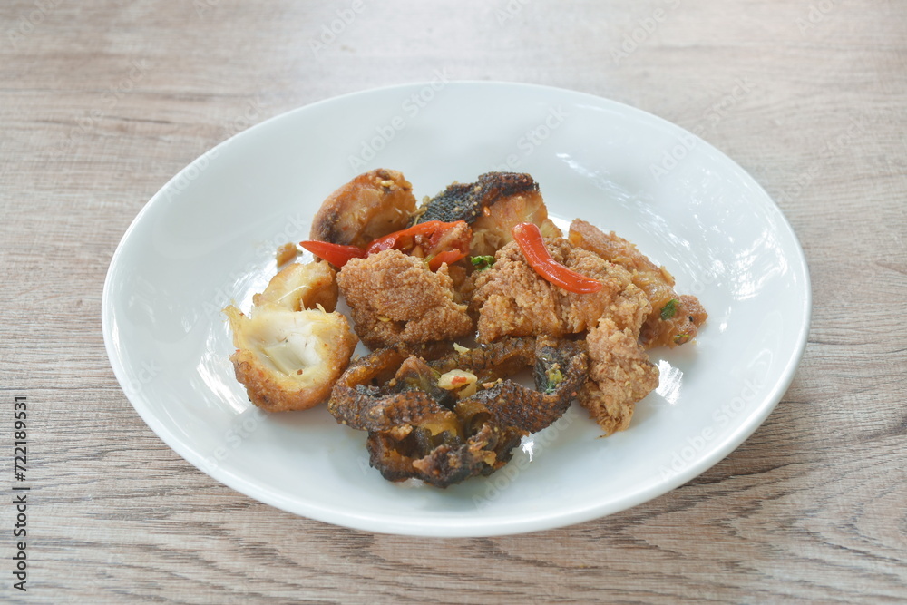 deep fried slice common silver barb fish with chili sweet vinegar on plate 