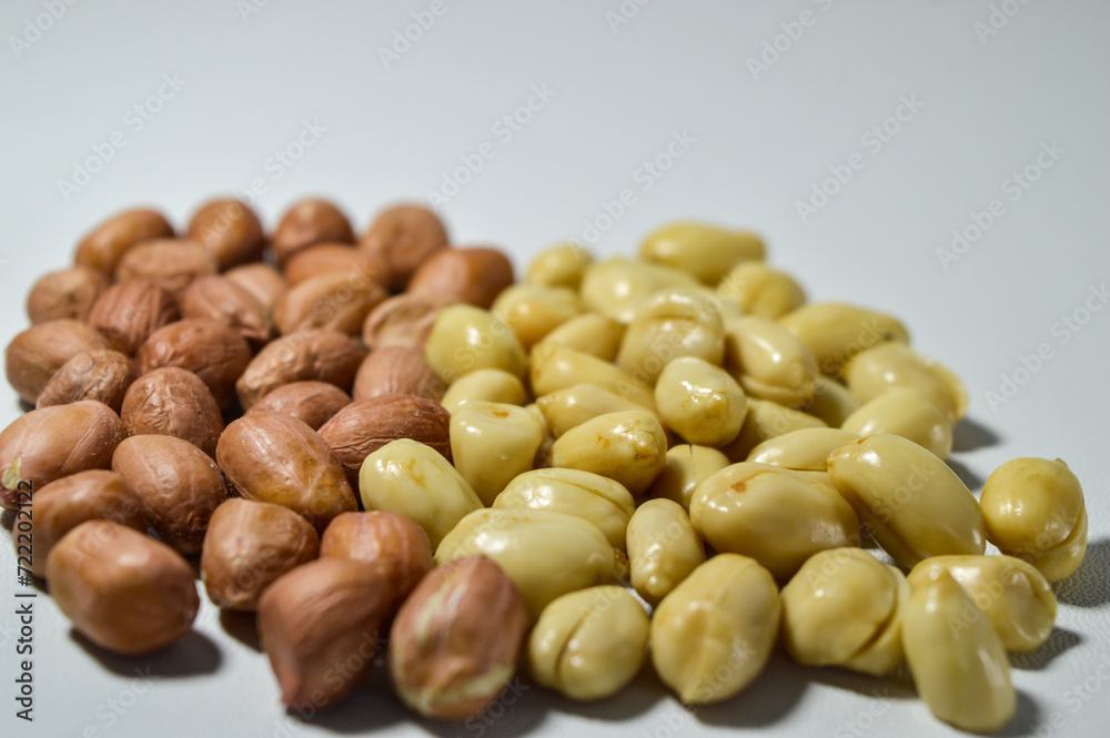 Kacang goreng or fried peanuts. Indonesian snacks. Isolated on a white background. Selective focus Kacang goreng or fried peanuts. Indonesian snacks. Isolated on a white background. Selective focus