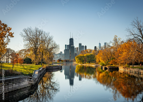 Chicago skyline seen from the north at dawn in Autumn with canal 