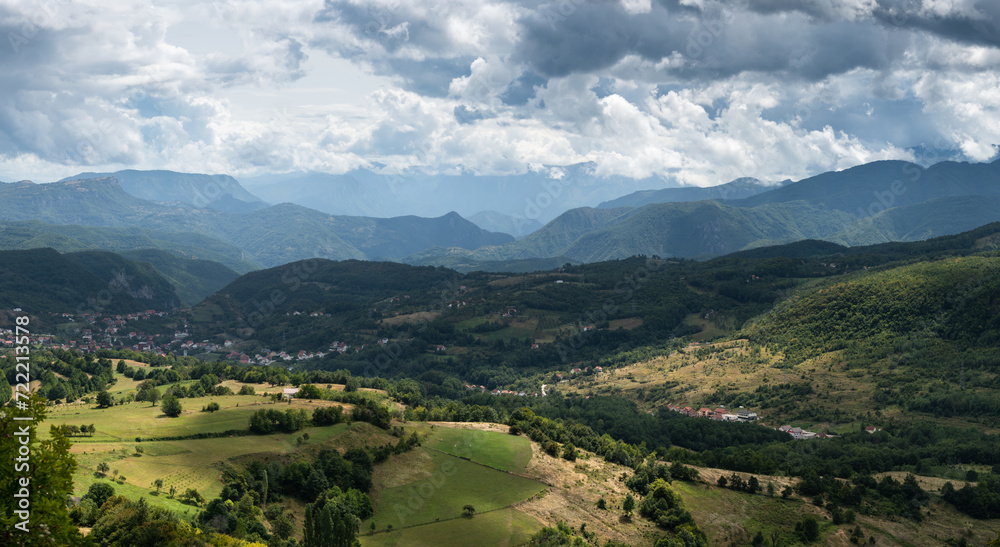 Settlement in valley surrounded with mountains, countryside near Prozor in Bosnia and Herzegovina, mountain landscape