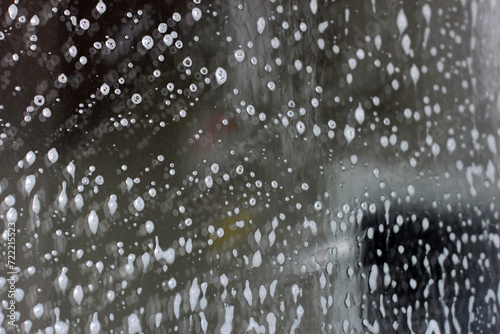 White cleaning foam on glass