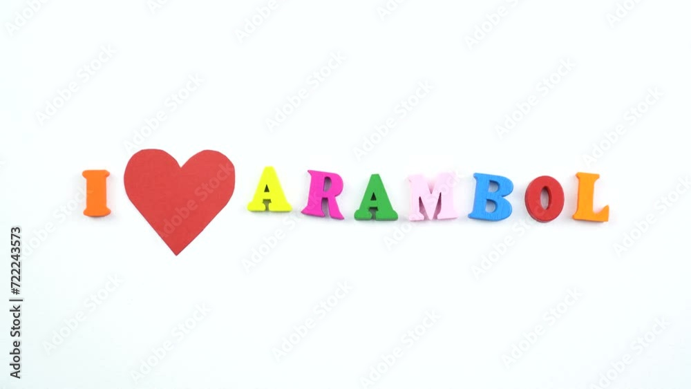 I love Arambol. Text from colorful wooden letters and a beating paper red heart. I love Arambol. Text from colorful wooden letters and a beating paper red heart.