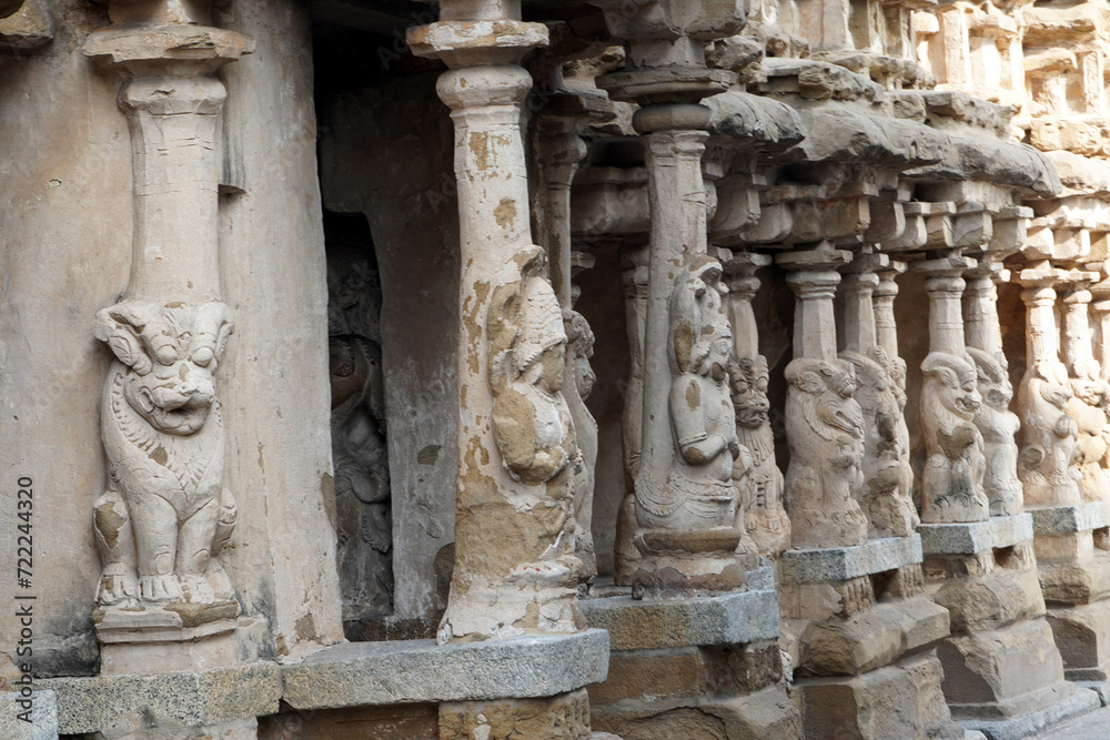 Row of pillars with carvings of Lion sculpture in in ancient Kanchi Kailasanathar temple in Kanchipuram, Tamil nadu. Indian art of Animal relief sculptures carved in sandstone at historic temple.