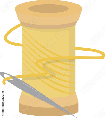 Old yellow thread spool and needle
