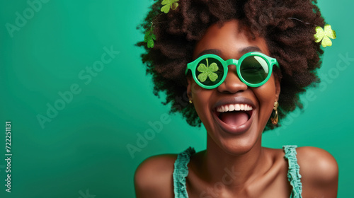 Happy African American young woman smiling and fun celebrating St. Patrick Day