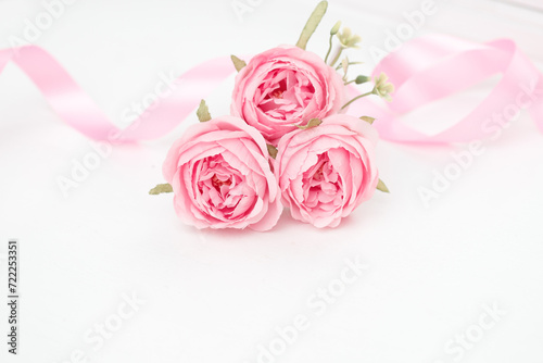 Two pink roses and ribbons isolated on white background  Valentines day