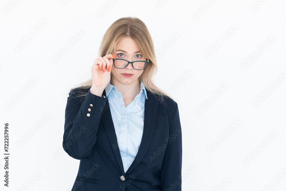 Attractive blond businesswoman standing and smiling isolated on white background Attractive blond businesswoman standing and smiling isolated on white background