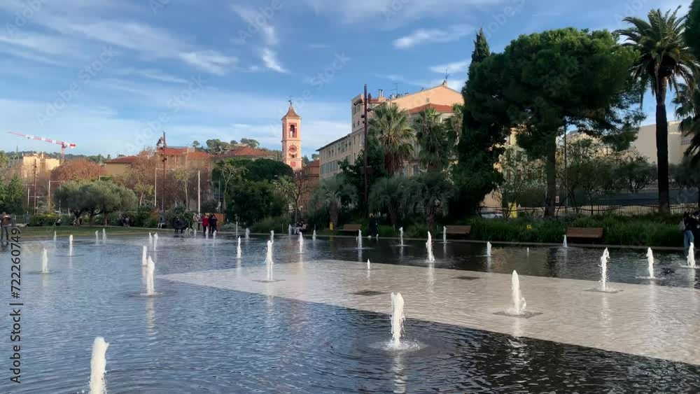 Tiny water fountains are running at Promenade du Paillon Park. Splashing water jets. Park at Nice city centre. Popular recreation and sightseeing place. Nice, Cote d'Azur, France