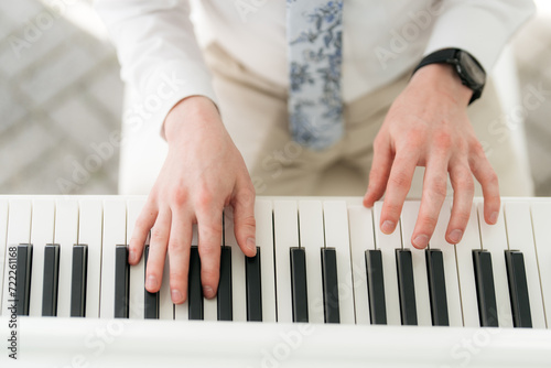 hands of a person playing piano at a wedding