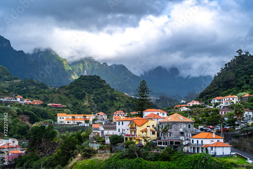 Scenic village on the north coast in a green, overgrown valley on a cloudy day. Sao Vincente, Madeira Island, Portugal, Europe.