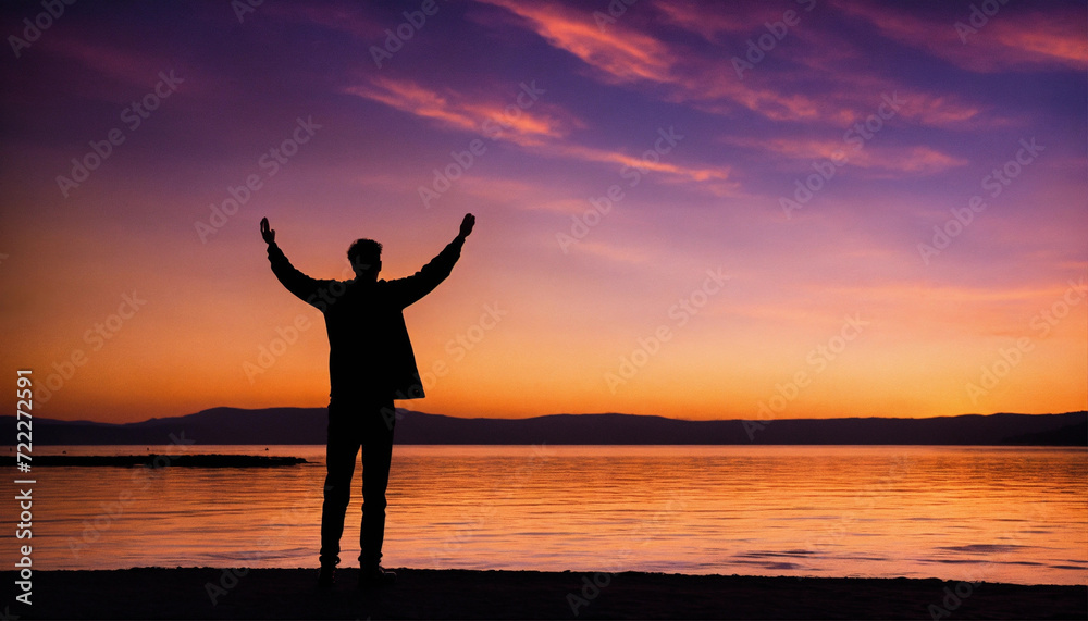 Man standing on top of mountain with raised hands. Success concept. man rise arm with sunrise