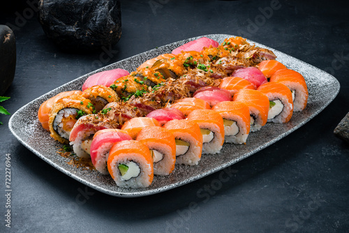 Japanese sushi rolls with salmon, tuna, shrimp, eel, avocado, cream cheese and cucumber.