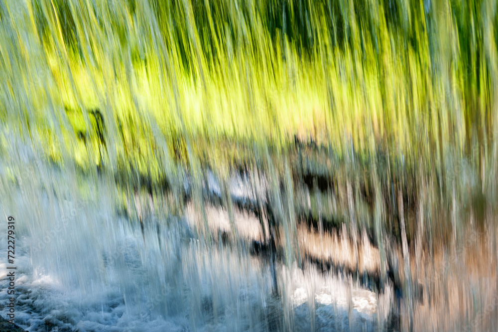Wall of water. A beautiful view green trees and river through the falling water cascade. Wall of water. A beautiful view green trees and river through the falling water cascade.