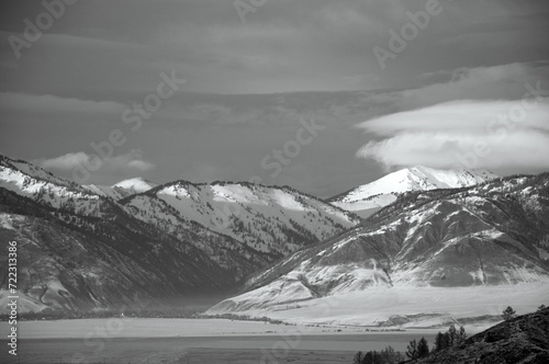 Cold snowy mountain landscape at sunset.