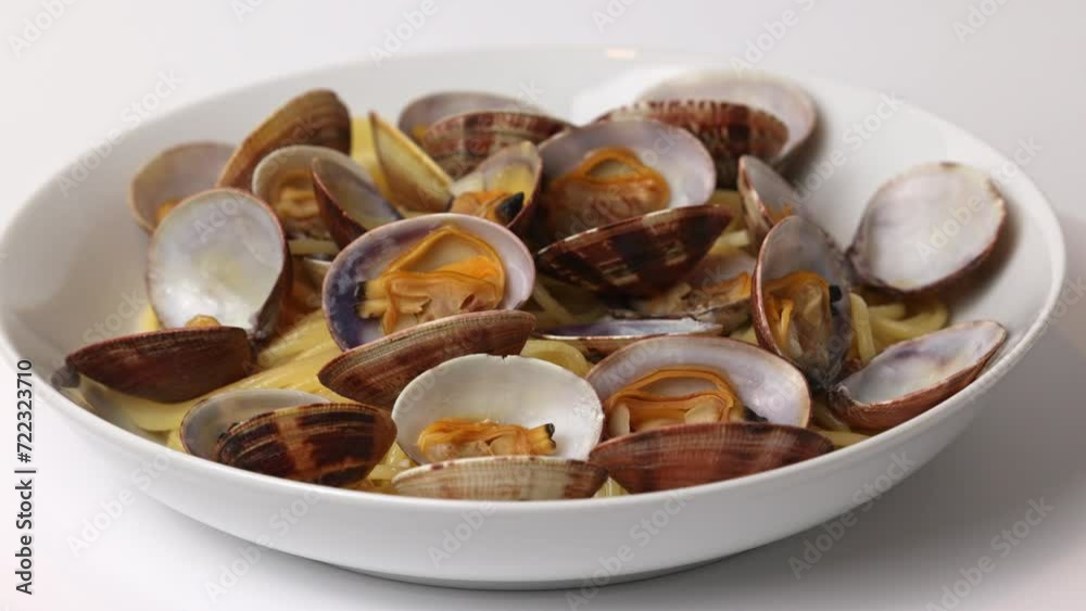 Close-up of plate with the Italian dish Spaghetti Alle Vongole. 360 rotation. Close-up of plate with the Italian dish Spaghetti Alle Vongole. 360 rotation.