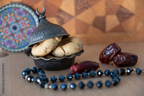 Arabic sweets with dates on arabesque background with arabian decorations