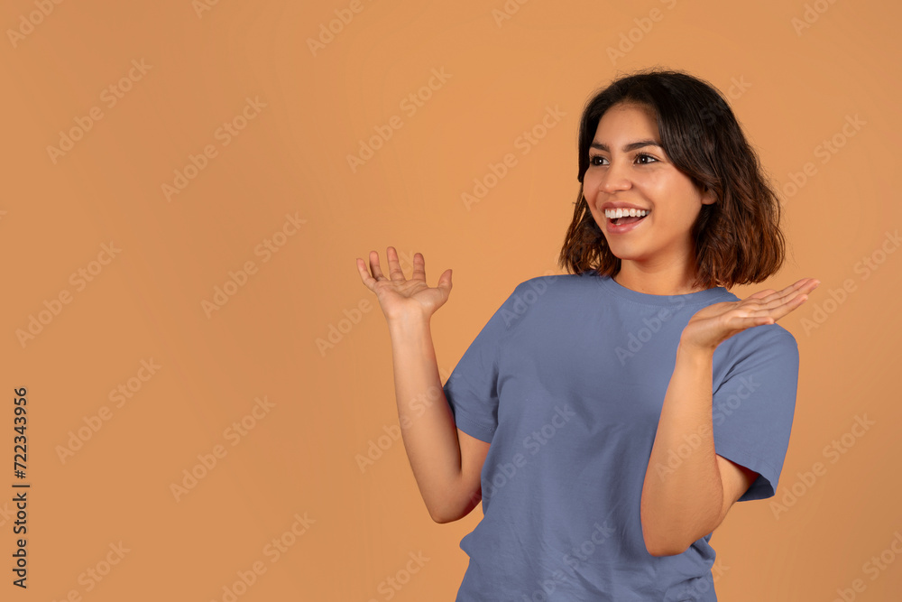 Amazed young arab woman looking at copy space Amazed young arab woman looking at copy space
