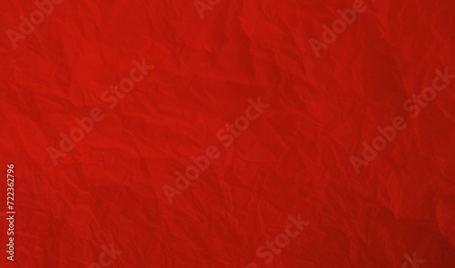 Torn crumpled red paper background photo