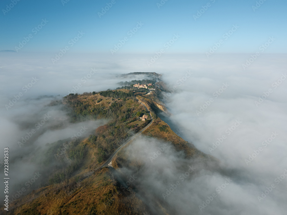 Italy, January 28, 2024: aerial view of the San Bartolo park immersed in autumn fog. We are near Pesaro and Romagna in the Marche region