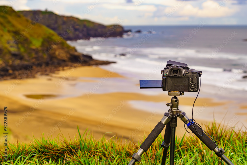 Camera taking picture of sea coast view, Asturias Spain. Camera taking picture of sea coast view, Asturias Spain.