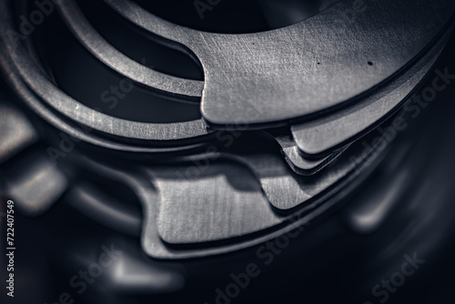 Fotografía Close up of small metal gears and parts stacked up after production