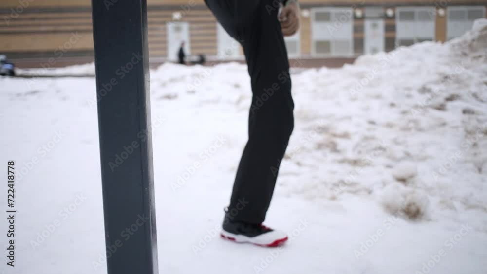 Man bend to legs on horizontal bar changing their with raised hands Man bend to legs on horizontal bar changing their with raised hands