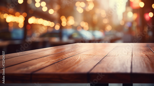 A wooden table in a cafe or restaurant with a blurred background featuring bokeh effects
