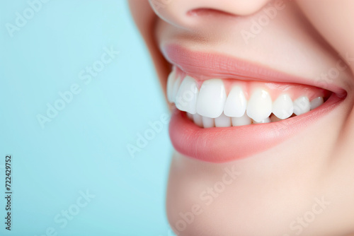 Healthy White Smile Close-up with Perfect Teeth on Light Blue Background. Dentistry concept