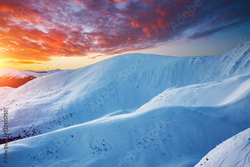 Breathtaking sunset over snow-capped mountains.