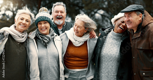 Happy, portrait and senior friends in a park while walking outdoor for fresh air together. Diversity, smile and group of elderly people in retirement taking picture and bonding in a forest in winter. photo