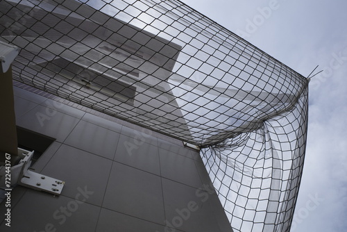 Safety net seen from below to avoid accidents due to maintenance works in the facade of a building