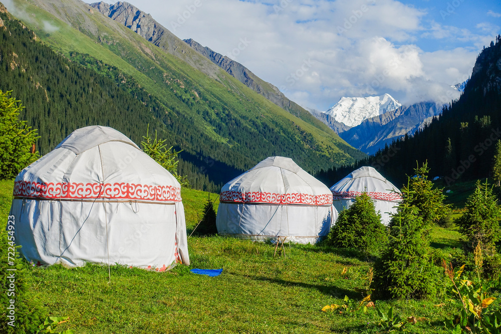 Living in the mountains in a tents. Tourist white tent on hight moutain