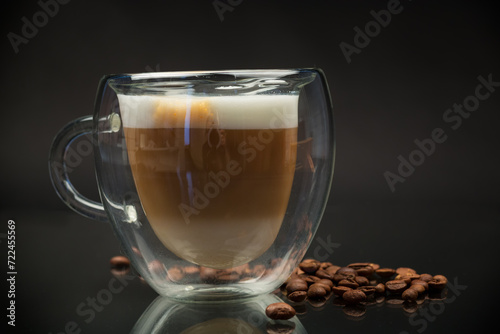 hot coffee with milk on black background
