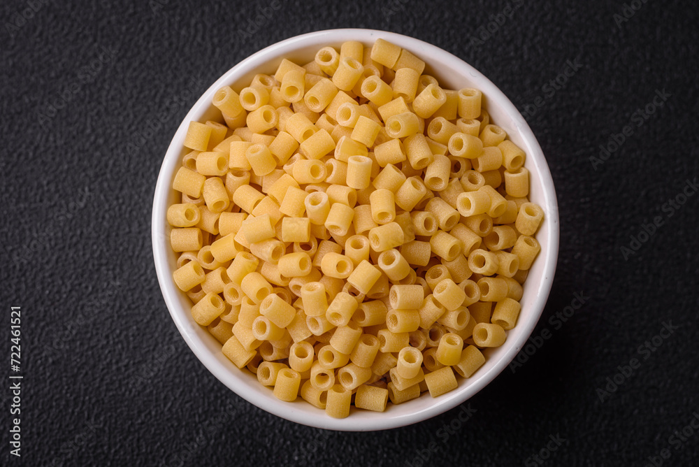 Delicious ditali pasta from durum wheat with salt and spices Delicious ditali pasta from durum wheat with salt and spices