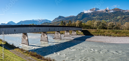 The historic old Rhine bridge between Liechtenstein and Switzerland photo