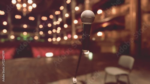 An Intimate Opera Performance on an Empty Stage with Microphone and Chairs