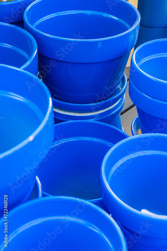 Bright blue ceramic plant pots at local nursery.