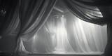 A stage with sheer curtains and a stage light. Perfect for theater performances or live events