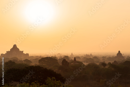 Scenic landscape and silhouette of many ancient temples and pagodas at the plain of Bagan in Myanmar  Burma  at sunrise.
