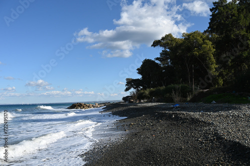Fototapeta Naklejka Na Ścianę i Meble -  waves on the beach near a restaurant on the Mediterranean coast 11