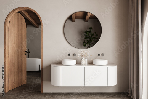 Beige bathroom interior with double sink and mirror, carpet on hardwood floor, bathtub, plants. Bathing accessories and window in hotel studio, arches.