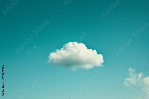 The vast blue sky is interrupted by a solitary cumulus cloud, floating gracefully amidst the endless expanse of nature